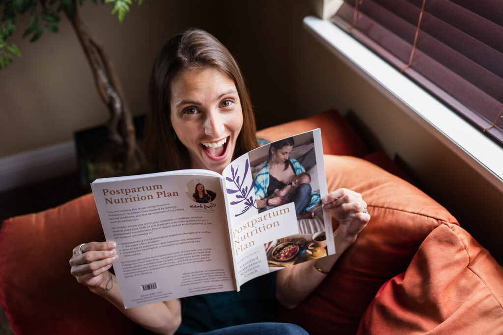 Maranda Bower with her book Postpartum Nutrition Plan